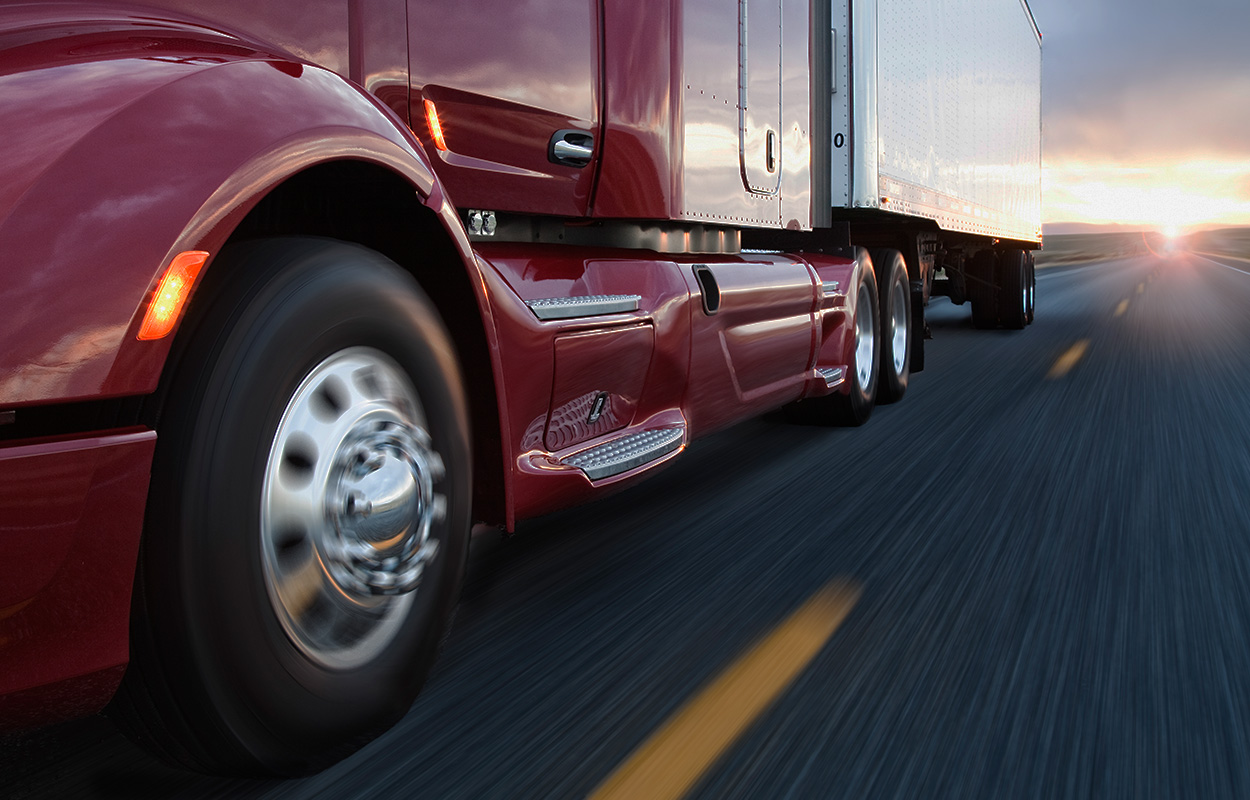tractor-trailer speeding down the highway